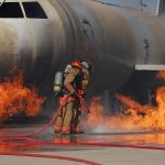 Airmen from the 312th Training Squadron extinguish a fire on a training module to demonstrate an aircraft incident at Goodfellow AFB